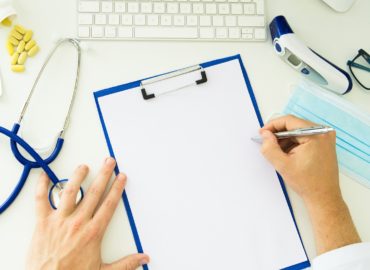 Medical desktop with white paper mock up
